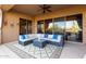 Large covered patio features comfortable seating and views of the Arizona desert at 42019 N Golf Crest Rd, Anthem, AZ 85086