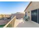 Lovely balcony with wrought iron railings offering peaceful views of the surrounding community and mountains at 4285 S Celebration Dr, Gold Canyon, AZ 85118