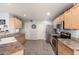 Bright kitchen featuring stainless steel appliances, tile floors, and ample countertop space at 4285 S Celebration Dr, Gold Canyon, AZ 85118