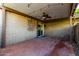 Covered patio with a ceiling fan, string lights, and a red brick floor at 4800 N 68Th St # 385, Scottsdale, AZ 85251