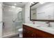 Updated bathroom features a spacious glass shower, dual vanity sinks, and modern fixtures at 4800 N 68Th St # 385, Scottsdale, AZ 85251