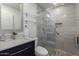 Modern bathroom featuring a glass-enclosed shower, floating shelves, and sleek fixtures at 4800 N 68Th St # 385, Scottsdale, AZ 85251