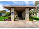 Community building entrance with brick columns and mature landscaping at 4800 N 68Th St # 385, Scottsdale, AZ 85251