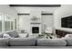 Bright living room with brick fireplace, gray sofa and lots of natural light from the windows at 4800 N 68Th St # 385, Scottsdale, AZ 85251