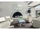 Cozy lounge area featuring comfortable armchairs surrounding a fireplace, creating a relaxing social space at 4800 N 68Th St # 385, Scottsdale, AZ 85251