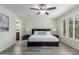 Comfortable main bedroom boasts stylish lamps, ceiling fan and en suite bathroom at 4800 N 68Th St # 385, Scottsdale, AZ 85251