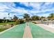 Well-maintained shuffleboard court offers a fun recreational amenity, set against scenic landscaping at 4800 N 68Th St # 385, Scottsdale, AZ 85251