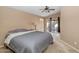 The main bedroom has vaulted ceiling, sliding door to the back yard, and carpeting at 5002 W Wikieup Ln, Glendale, AZ 85308
