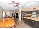 Open kitchen layout with granite countertops, dark cabinetry, and modern appliances at 5002 W Wikieup Ln, Glendale, AZ 85308