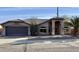 Charming single-story home featuring a tile roof, arched entryway and low maintenance desert landscaping at 5031 S Roosevelt St, Tempe, AZ 85282