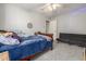 Bedroom with a futon, carpet, and a closet featuring a wood bed with blue bedding at 504 E Quentin Ln, San Tan Valley, AZ 85140