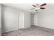 Bedroom featuring neutral walls, carpeted floors, and multiple closets at 504 E Quentin Ln, San Tan Valley, AZ 85140