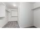 Walk-in closet with ample shelving and carpeted floor at 504 E Quentin Ln, San Tan Valley, AZ 85140