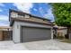 Charming two-story home featuring a gray two-car garage and a well-maintained front yard at 504 E Quentin Ln, San Tan Valley, AZ 85140