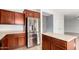 Kitchen with stainless steel refrigerator, island counter, and wooden cabinets at 504 E Quentin Ln, San Tan Valley, AZ 85140