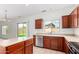 Well-lit kitchen featuring stainless steel appliances, tile flooring, and outdoor access at 504 E Quentin Ln, San Tan Valley, AZ 85140