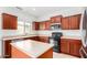 Kitchen with stainless steel appliances, island counter and plenty of cabinet space at 504 E Quentin Ln, San Tan Valley, AZ 85140