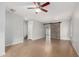 Spacious living room with tile flooring, a ceiling fan, and a rustic barn door at 504 E Quentin Ln, San Tan Valley, AZ 85140