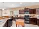 Modern kitchen with stainless steel appliances, ample cabinet space, and a functional layout for easy meal preparation at 5548 W Victory Way, Florence, AZ 85132