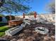 A backyard oasis featuring a hot tub, grilling area, and firepit, perfect for outdoor entertaining at 6016 W Gambit Trl, Phoenix, AZ 85083