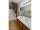 Bathroom featuring double sink vanity, tile floors, and shower and tub combination at 6016 W Gambit Trl, Phoenix, AZ 85083