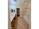 The well-appointed bathroom features a tub, a glass-enclosed shower, and tiled floors, for a clean and modern design at 6016 W Gambit Trl, Phoenix, AZ 85083
