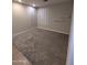 Bedroom with neutral carpet, white trim, shuttered windows, and built in wall shelves at 6016 W Gambit Trl, Phoenix, AZ 85083