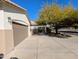 Long driveway leading to a two-car garage with mature landscaping around the home at 6016 W Gambit Trl, Phoenix, AZ 85083
