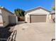 Spacious driveway leading to a two-car garage with ample parking and curb appeal at 6016 W Gambit Trl, Phoenix, AZ 85083