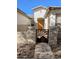 Inviting front entrance with a decorative gate and manicured landscaping at 6016 W Gambit Trl, Phoenix, AZ 85083