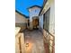 A close view of the wooden front door and sidelight windows at 6016 W Gambit Trl, Phoenix, AZ 85083