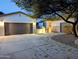 Charming single-Gathering home featuring a landscaped front yard and a two-car garage at 6016 W Gambit Trl, Phoenix, AZ 85083