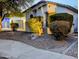 Charming single-Gathering home featuring a landscaped front yard and a two-car garage at 6016 W Gambit Trl, Phoenix, AZ 85083