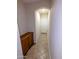 This hallway features tiled floors and a built-in cabinet, creating a welcoming transition into the home at 6016 W Gambit Trl, Phoenix, AZ 85083