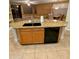 This kitchen island has a double sink, dishwasher, and granite countertops at 6016 W Gambit Trl, Phoenix, AZ 85083