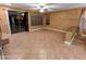 Spacious living room with tile flooring and a sliding glass door to the outside patio at 6016 W Gambit Trl, Phoenix, AZ 85083