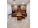 The office area features carpet floors, a built-in desk, cabinets, and a brown leather chair at 6016 W Gambit Trl, Phoenix, AZ 85083
