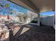 Spacious covered patio area with a built-in grill and cozy firepit, perfect for gatherings at 6016 W Gambit Trl, Phoenix, AZ 85083