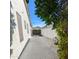 Side yard with a concrete walkway and a fence for added privacy at 6016 W Gambit Trl, Phoenix, AZ 85083