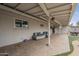 Wide covered back patio featuring comfortable seating and access to outdoor dining area at 6251 E Hannibal St, Mesa, AZ 85205