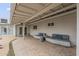 Inviting covered back patio features comfortable seating and a textured concrete floor at 6251 E Hannibal St, Mesa, AZ 85205
