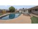 Backyard oasis with a private pool, lounge chairs, and lush landscaping at 6251 E Hannibal St, Mesa, AZ 85205