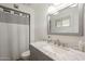 Updated bathroom with granite counters, stylish fixtures, and a neutral gray vanity at 6251 E Hannibal St, Mesa, AZ 85205