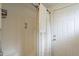 Functional bathroom featuring a sliding glass door shower and white door at 6251 E Hannibal St, Mesa, AZ 85205