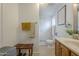 Cozy bathroom featuring wooden cabinets, warm lighting, and neutral tile flooring at 6251 E Hannibal St, Mesa, AZ 85205