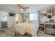 Serene bedroom with wood floors, lots of sunlight, and ensuite bathroom at 6251 E Hannibal St, Mesa, AZ 85205