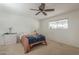 Cozy bedroom with ceiling fan, neutral carpet, and plenty of natural light at 6251 E Hannibal St, Mesa, AZ 85205