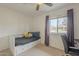 This bedroom is perfect for sleeping with a great window and chair for a home office at 6251 E Hannibal St, Mesa, AZ 85205