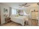 Bright bedroom featuring a comfortable bed, stylish decor, and ample natural light at 6251 E Hannibal St, Mesa, AZ 85205