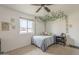 Bright bedroom with decorative ivy, a ceiling fan, and ample natural light at 6251 E Hannibal St, Mesa, AZ 85205